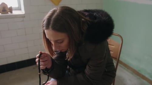 Woman with Prayer Beads Indoors