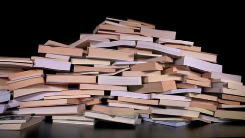 Pile of Books Creating a Towering Wall