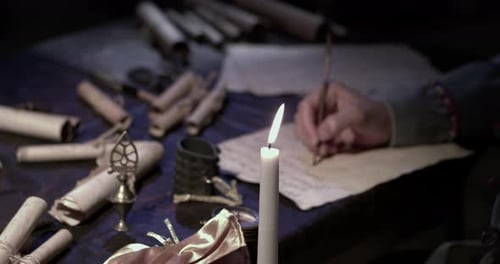 Writing by Candlelight in Dark Historical Setting