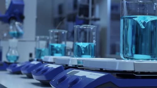 Blue Liquid Being Mixed in a Lab