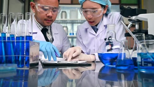 Scientists Collaborating on Research in Modern Laboratory