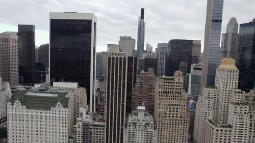 Aerial view of skyscrapers, in midtown Manhattan, overcast day, in New York city, USA - tracking, dr
