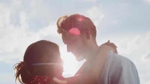 Young Couple Embracing in the Sunshine