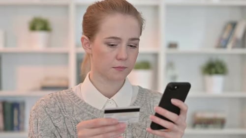 Woman Buys Online Using Smartphone and Credit Card