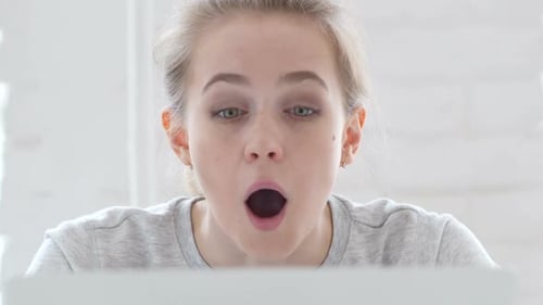 Woman Reacting to Good News on Computer