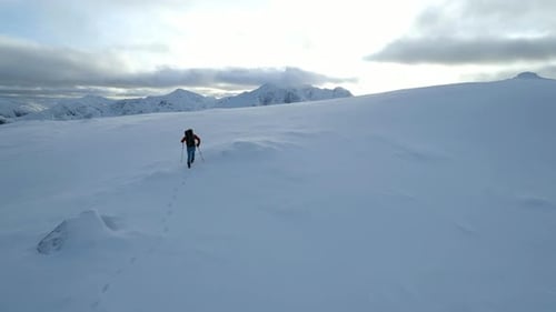 Mountain Climber Reaching the Summit of a Mountain