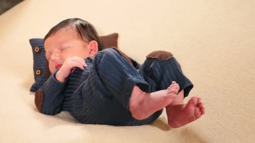 Adorable Infant Asleep on Soft Blanket Indoors