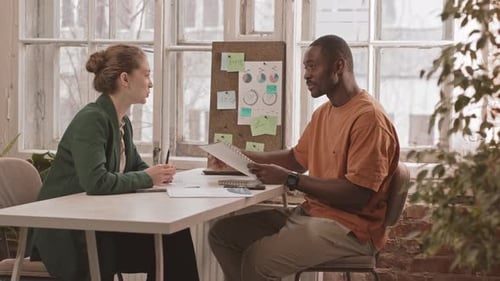 Diverse Colleagues Talking During Work in Office