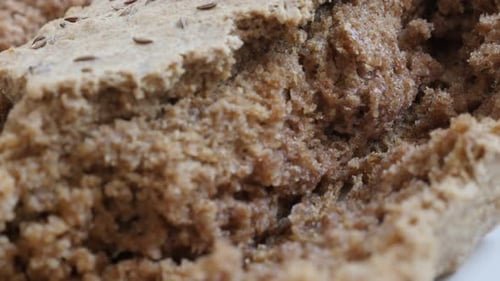 Staple food detailed brown surface close-up slow tilt 4K 2160p 30fps UltraHD footage - Tasty looking