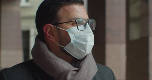 Close-Up of Man Wearing Mask and Glasses