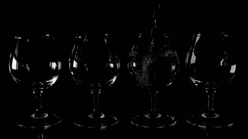 Crystal Glasses Being Filled With Liquid