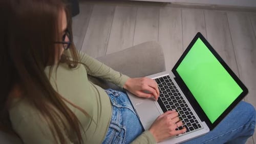 Woman in Glasses Working on Laptop Green Screen Chromakey