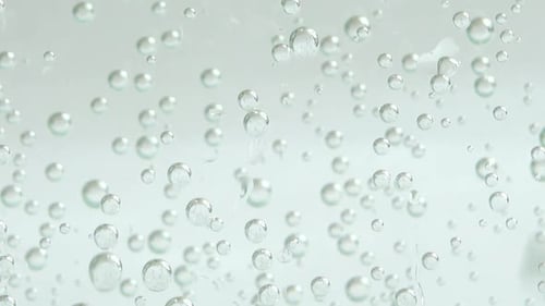 Air bubbles of the fizzy water.