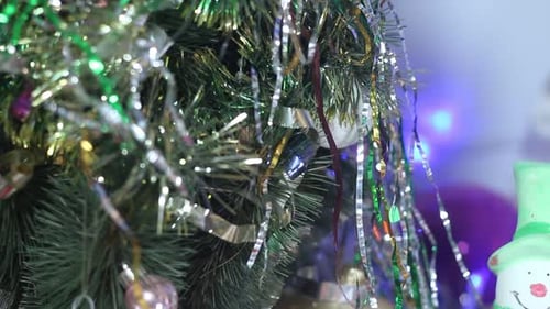Festive Christmas Tree Decorated with Tinsel and Ornaments