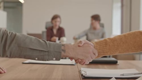 Professional Handshake At Office Meeting