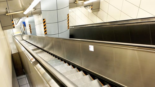 Empty Escalator Ascending in Urban Subway Station
