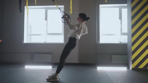 Fitness Woman Workout Exercise with Trx Equipment in the Fitness Gym Healthy Lifestyle Building