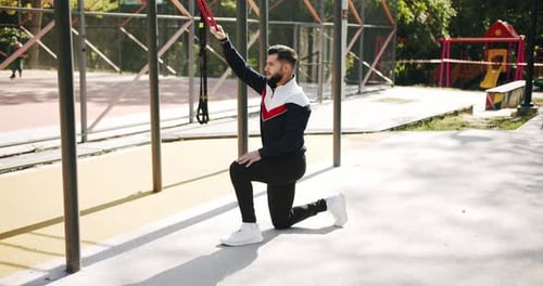 Attractive Fitness Man Does Exercising Outside
