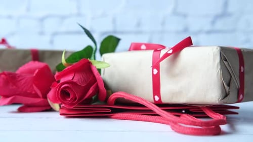 Elegant Gift with Red Rose and Ribbon