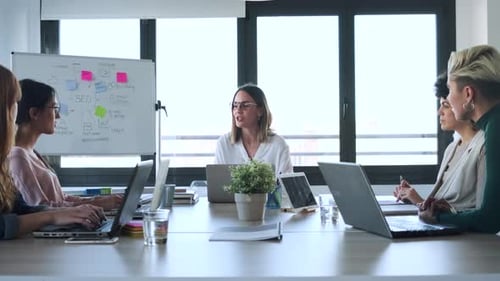 Slow motion shot of businesswomen during meeting in office