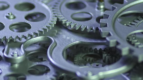 Intricate Metallic Gears Moving in Close Up View