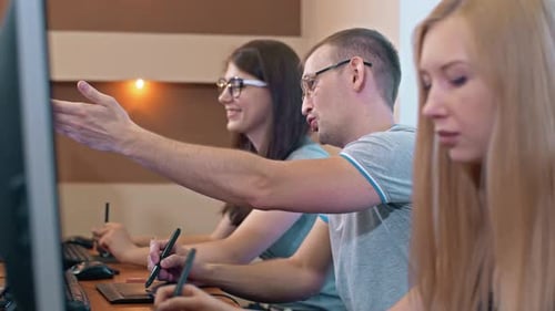 Collaborative Team Working on Computers in the Office