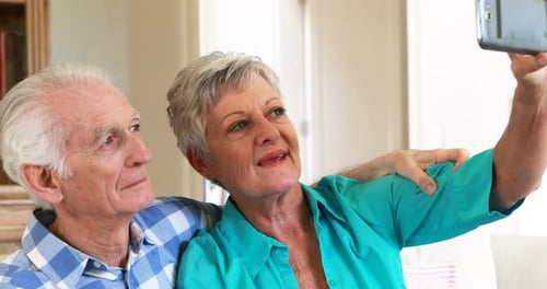 Senior Couple Taking a Selfie at Home