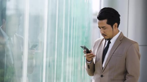 young business man using a smartphone in office