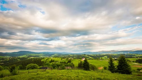 Time Lapse of Blue Sky with Clouds Over Mountain