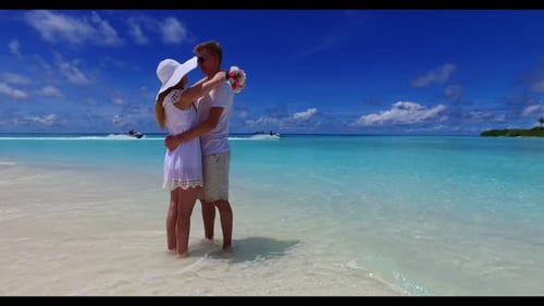 Family of two suntan on exotic resort beach holiday by blue sea and clean sand background of the Mal