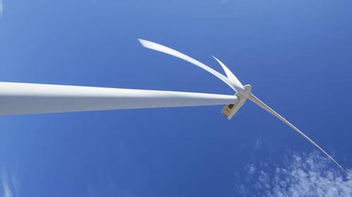 Vertical Shot of Windmill on Clear Blue Sky Background with Bright Sunlight USA