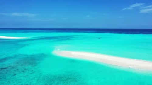 Aerial drone shot seascape of paradise bay beach lifestyle by aqua blue ocean with white sand backgr