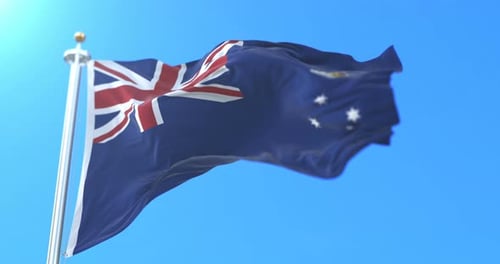 Victoria Australian State Flag Waving Against Blue Sky