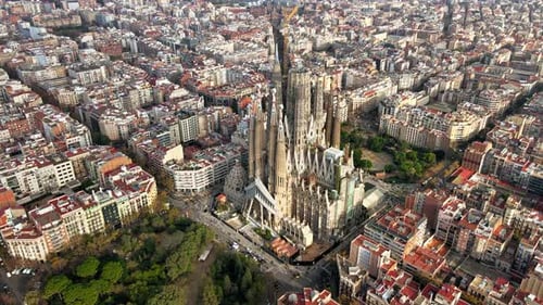 Aerial drone view of Barcelona, Spain. Blocks with multiple residential buildings and Sagrada Famili