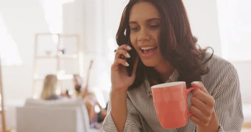 Smiling Woman Chatting on Phone with Mug
