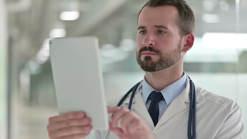 Close Up of Doctor Using Tablet in Hospital