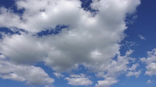 Billowing White Clouds Against Blue Sky