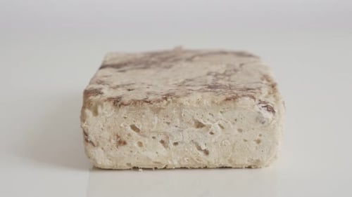 Block of sesame halva slow tilt 4K footage