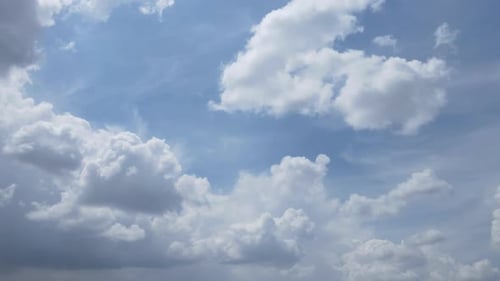Time Lapse of White Clouds Drifting in Blue Sky