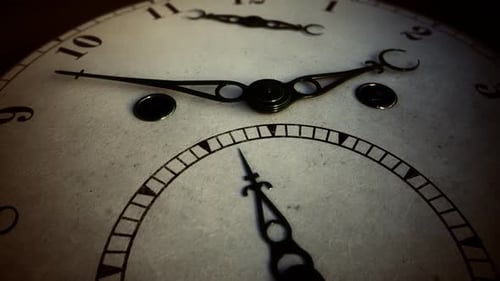 Retro antique clock. The decorative hands of the clock are moving on the dial.