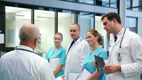 Medical Professionals Discussing Patient Care in Hospital Setting
