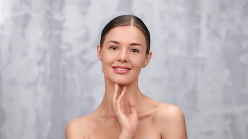 Young Woman Touches Her Beautiful Face Posing