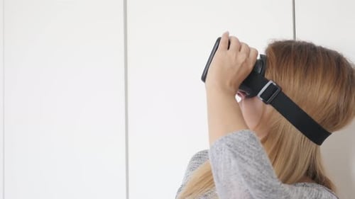 Woman Experiences Virtual Reality With VR Headset