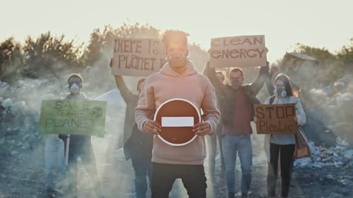 Group Protesting Pollution in the Landfill with Signs