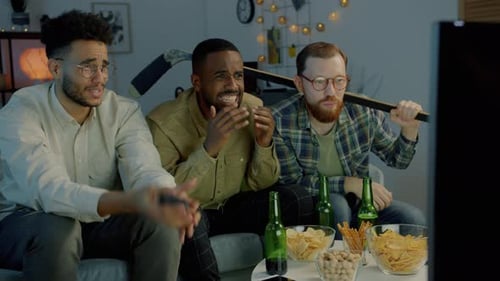 Diverse Group of Men Watching Hockey Championship on TV at Home Expressing Disappointment with Game