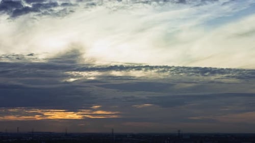 Dramatic Sunrise Time Lapse Above City Skyline