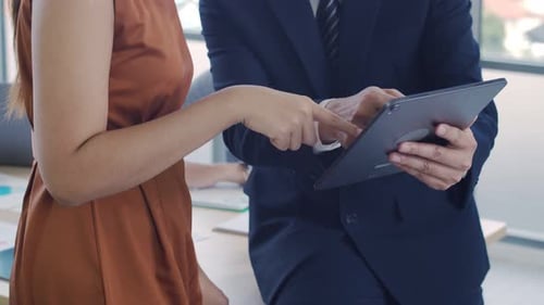 Exclusive manager showing plan project to a creative businesswoman in the modern office.