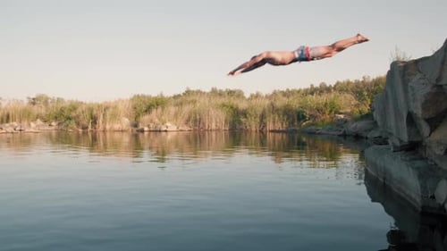 Young Man Diving into Lake
