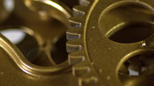 Clockwork Gears Turning in Golden Light