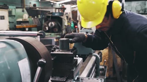Smart Factory Worker Using Machine in Factory Workshop